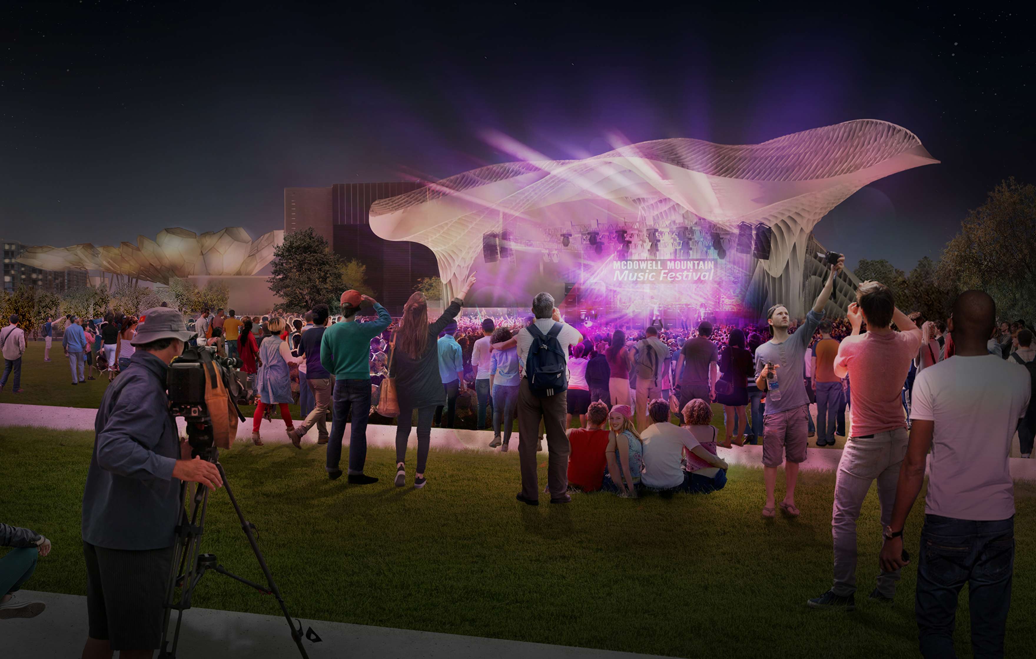 A crowd gathered outdoors at night for a music festival. The stage is illuminated with pink and purple lights, and various people are standing, sitting, and recording the event.