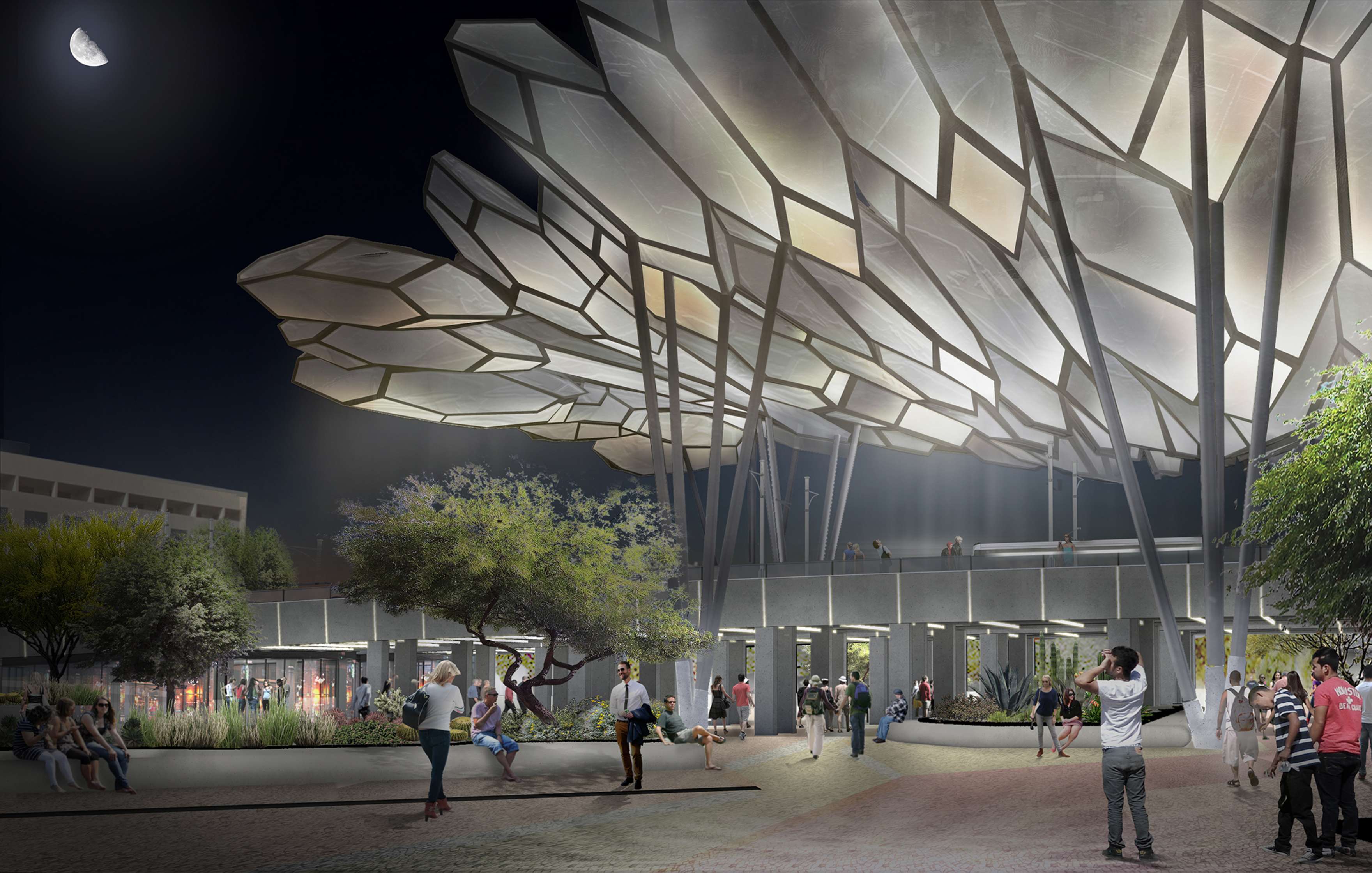 People gather in a modern outdoor plaza at night, illuminated by large, tree-like light structures with geometric canopies. A full moon is visible in the sky.