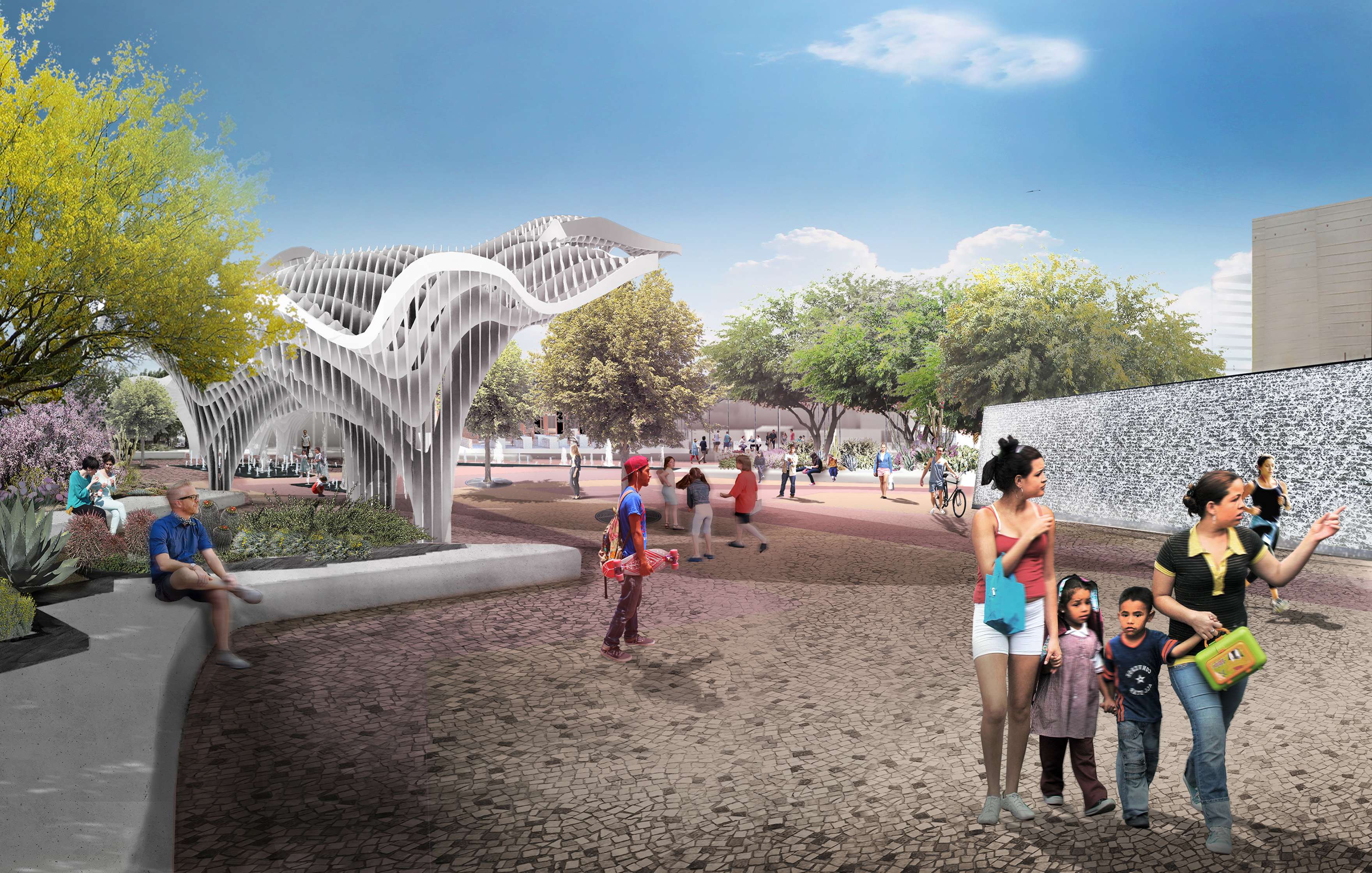 People walking and sitting in a modern public plaza with sculptural architecture, trees, and a mosaic wall under a clear blue sky.