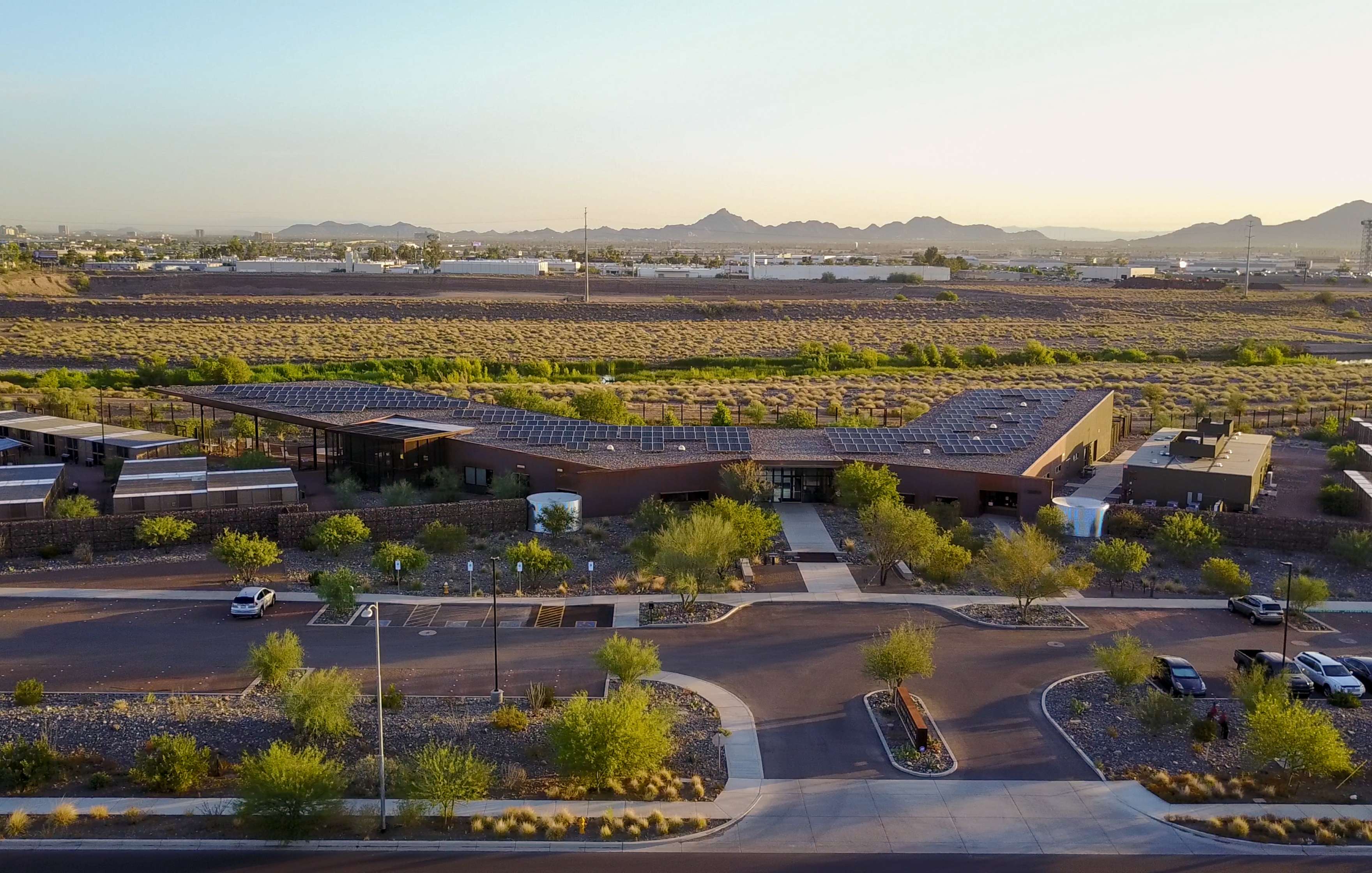 Aerial map view of an urban area showing downtown, an airport, roads, developed land, and the Rio Salado Habitat Restoration Area stretching across the bottom, marked with the labels “Downtown Phoenix,” and “Brownfield Sites.”