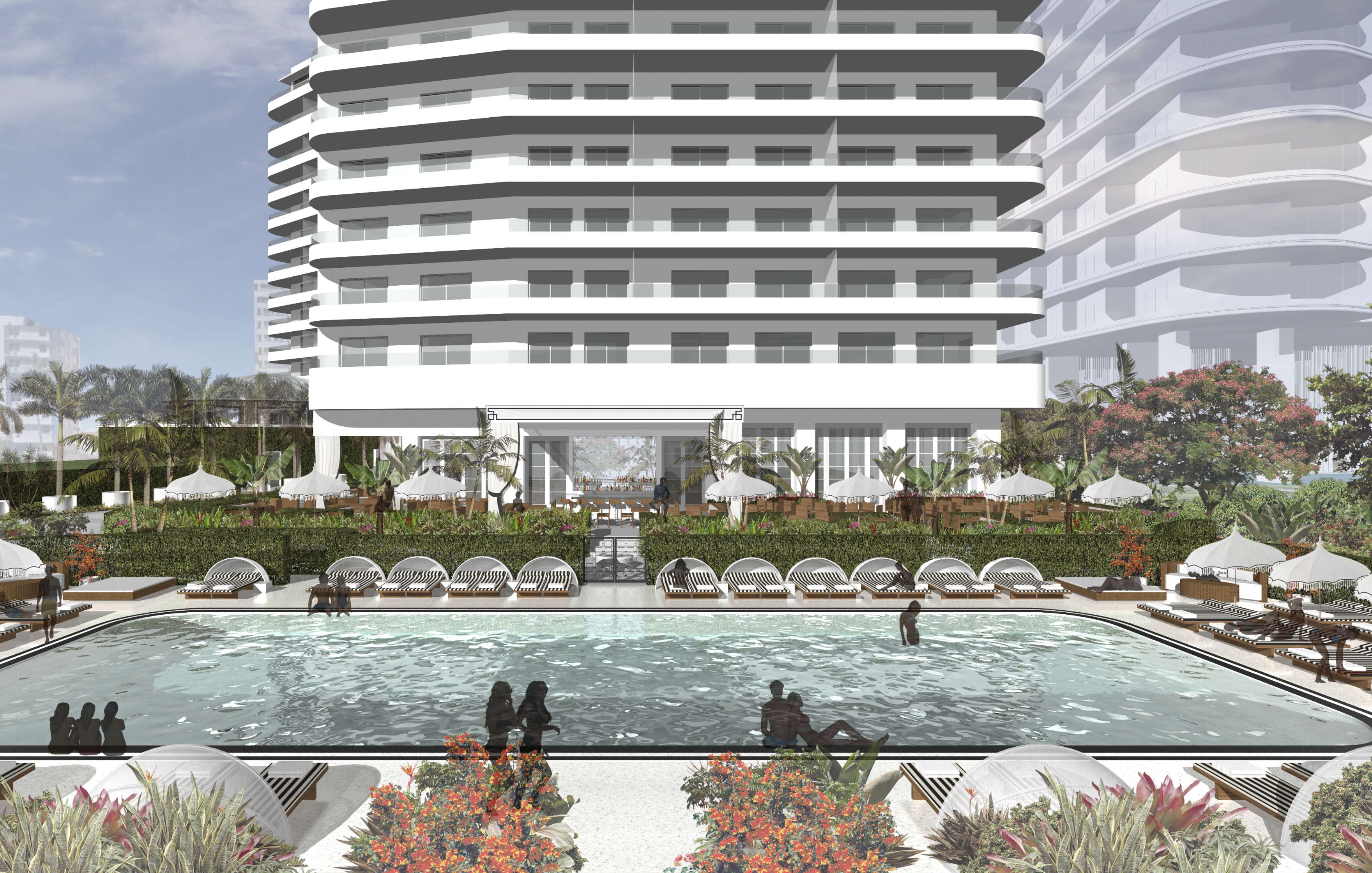 Outdoor pool area with lounge chairs, umbrellas, and people swimming in front of a modern, multi-story building surrounded by lush greenery.